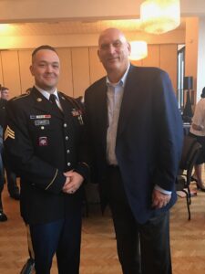 Photo of SGT Benjamin R. Lueck and General Raymond Odierno at a leadership conference hosted at West Point Military Academy.